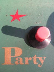 Button with the word 'party' next to it