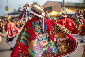 Dancers in Colorful Clothes Dancing on a Parade during a Festival in Colombia