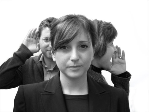 People listening and speaking to someone on both sides.