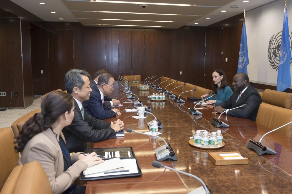 Group of people having a discussion at a table.