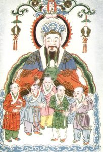 an image of the kitchen god, with children in the foreground.